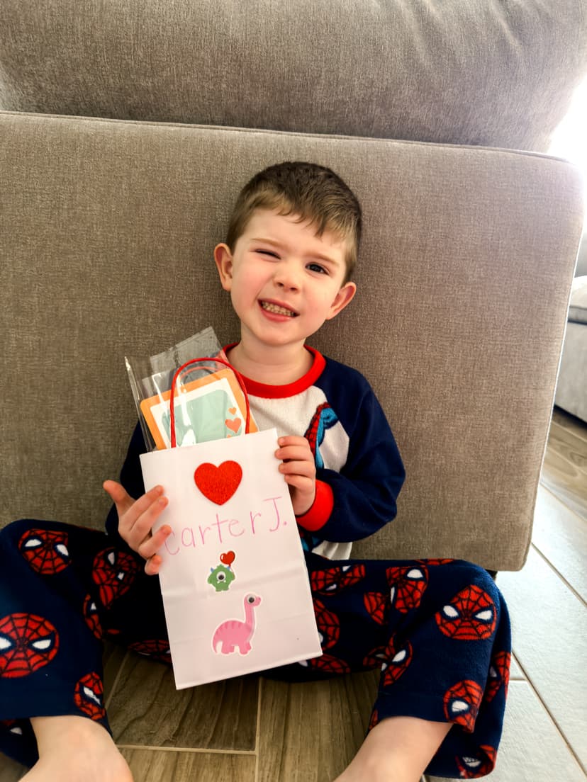 Carter holding his Valentine's bag