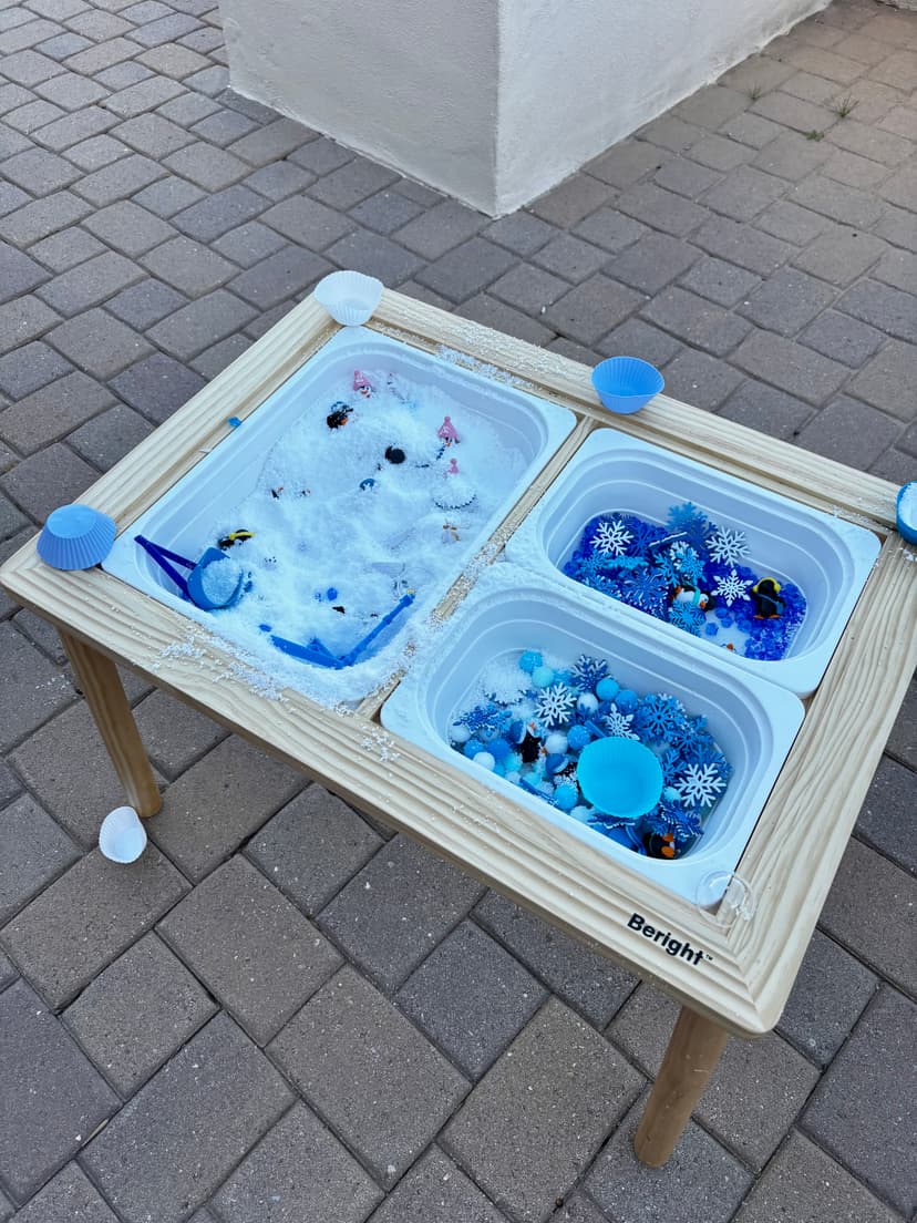 Winter wonderland sensory bin with snow and snowflakes